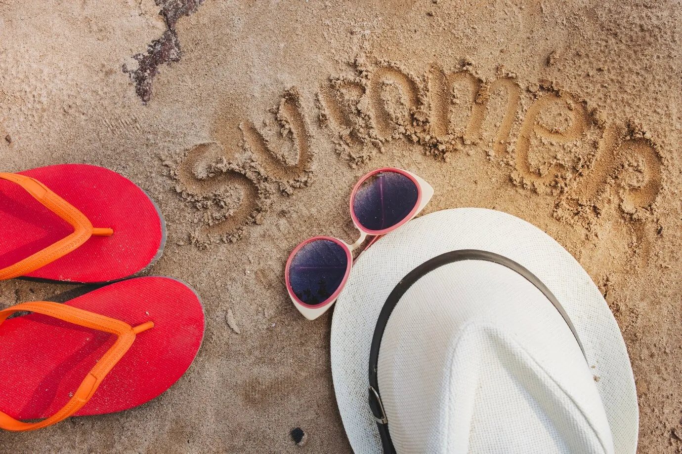 Summer composition with hat flip flops sunglasses