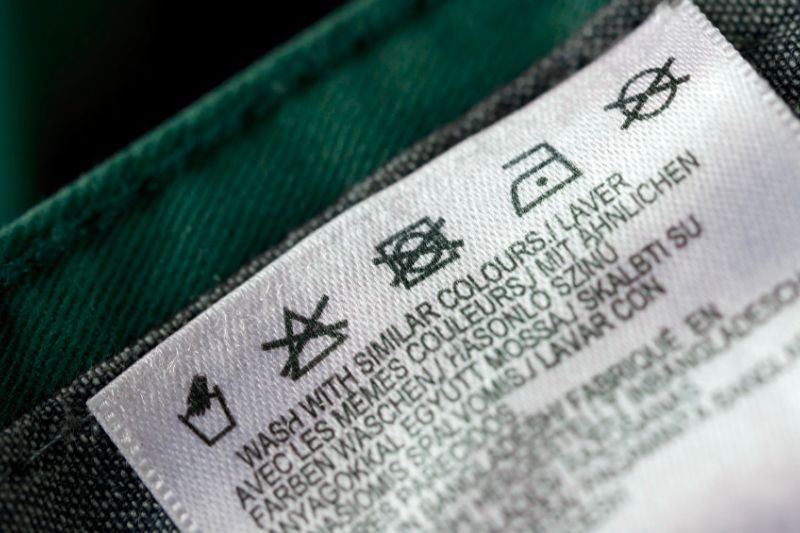 The care label on your swim trunks provides specific instructions based on the materials used